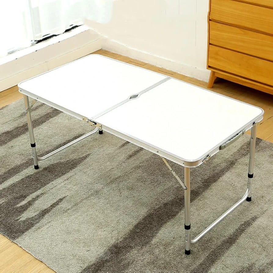 Folding adjustable table