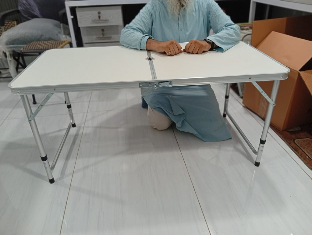 Folding adjustable table
