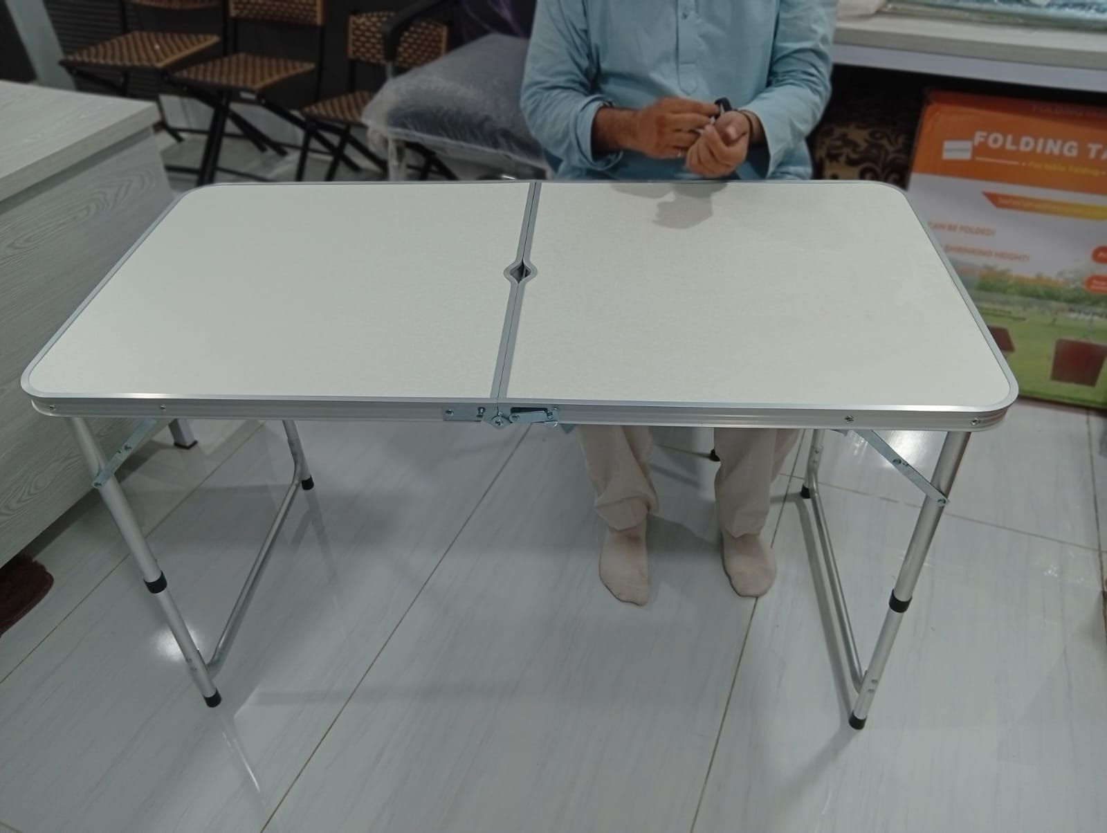 Folding adjustable table